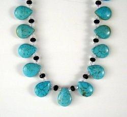 Simulated Turquoise Teardrop stones with onyx and bead spacers necklace.simulated 