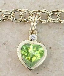 Ladies Peridot Heart Gold Charm Braceletladies 