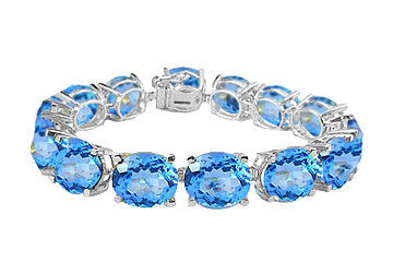 Sterling Silver Prong Set Oval Blue Topaz Bracelet with 50.00 CT TGW